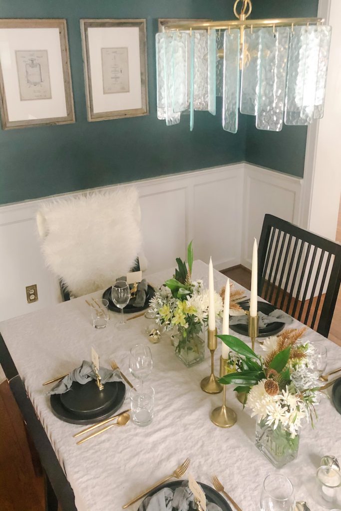 overhead image of a neutral tablescape and a crystal chandelier