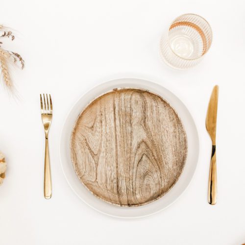 wood plate place setting with pumpkins