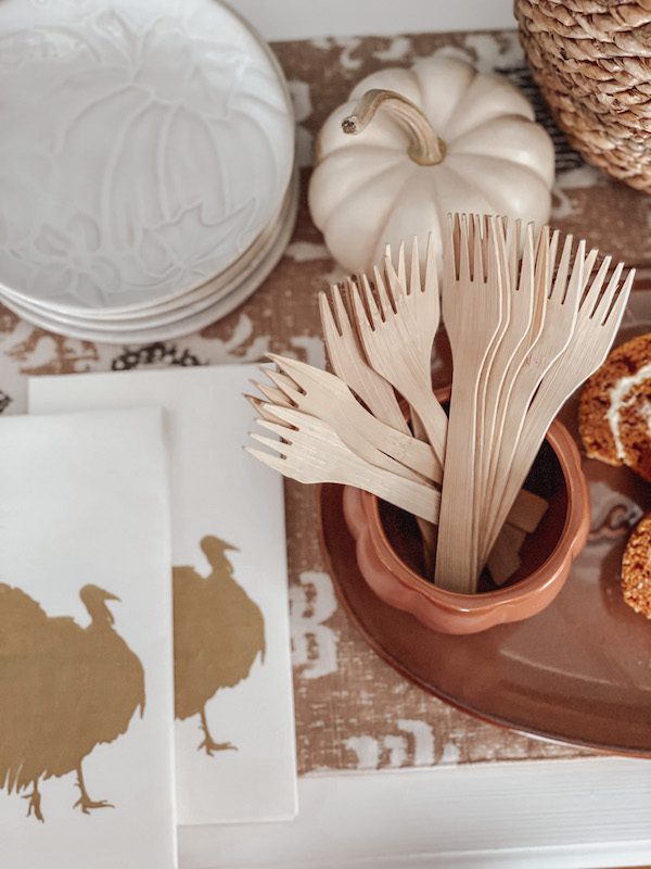thanksgiving napkins and plates on a dessert table