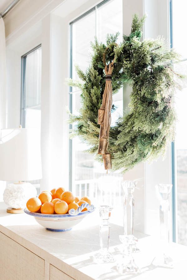 Christmas wreath and bowl of oranges