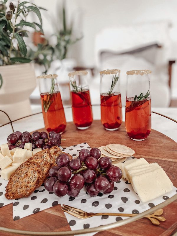 pomegranate mimosa on a wood tray