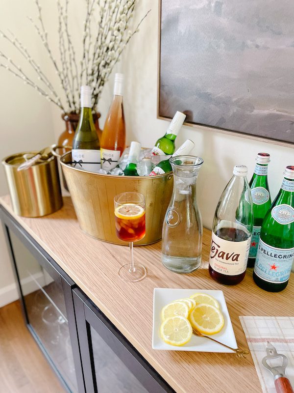 wine beer and iced tea set up for summer dinner party